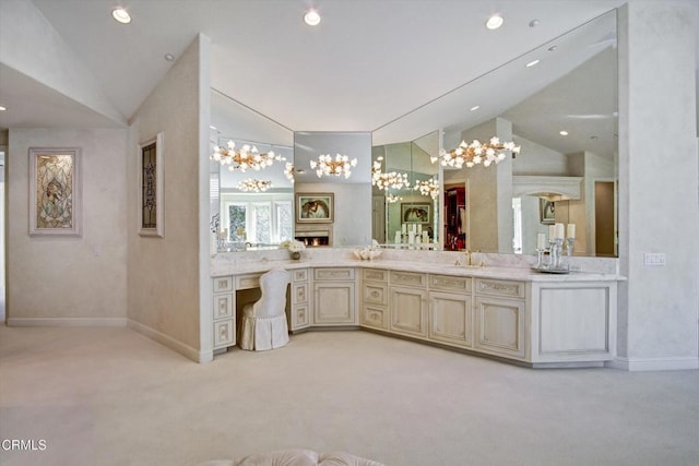 bathroom featuring vanity and vaulted ceiling