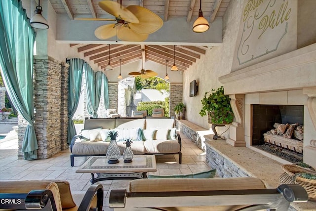 interior space with an outdoor living space with a fireplace