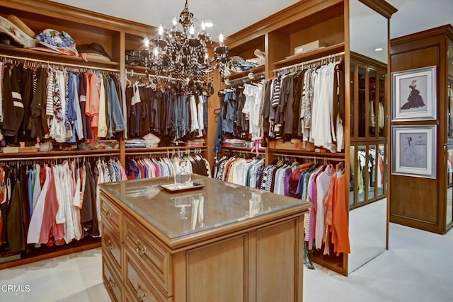 walk in closet with a notable chandelier