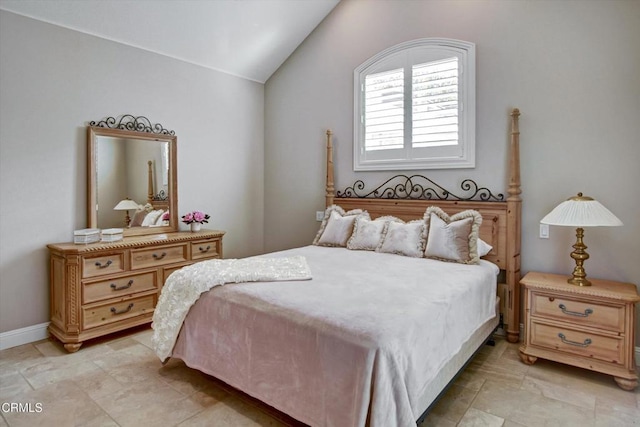 bedroom featuring vaulted ceiling