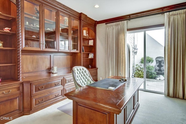 carpeted office featuring crown molding