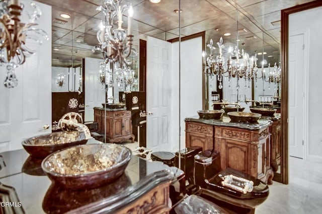 bathroom featuring vanity and a notable chandelier