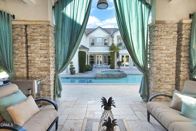 view of pool featuring outdoor lounge area, a patio area, an in ground hot tub, and french doors