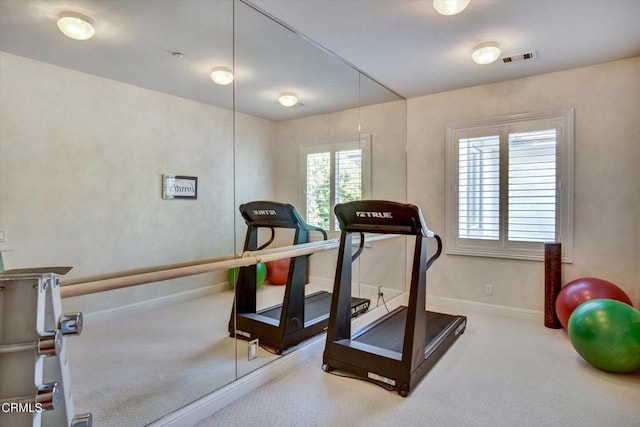 exercise room with carpet floors