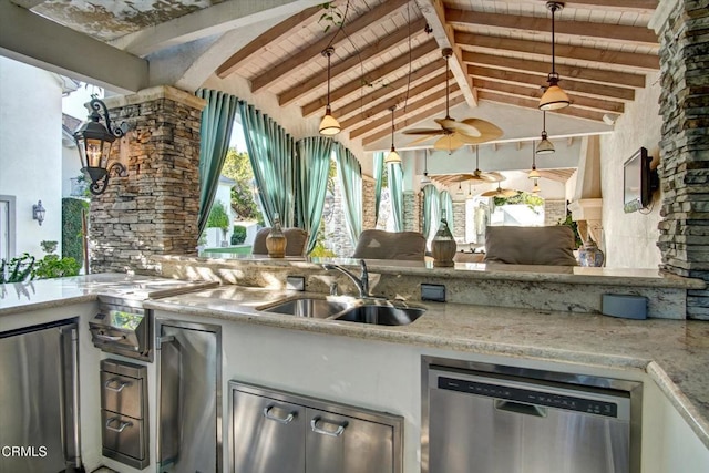 kitchen featuring lofted ceiling with beams, sink, light stone countertops, decorative light fixtures, and stainless steel appliances