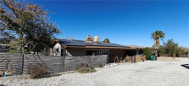 view of front of home with solar panels