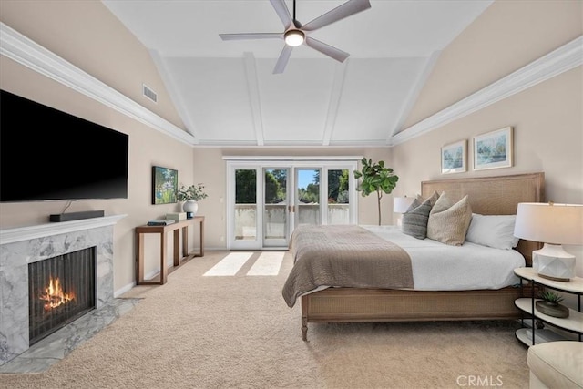 carpeted bedroom with ceiling fan, access to exterior, a premium fireplace, and high vaulted ceiling