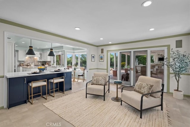 living room featuring crown molding