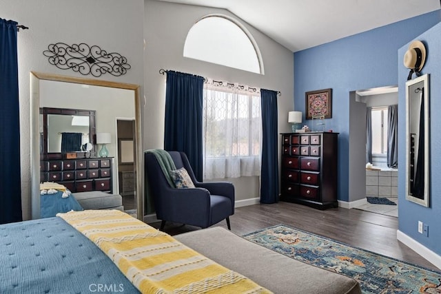 bedroom featuring dark hardwood / wood-style flooring and vaulted ceiling