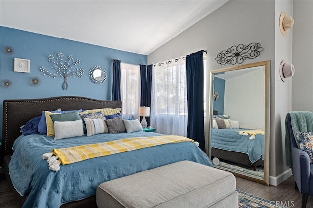 bedroom with lofted ceiling and hardwood / wood-style floors