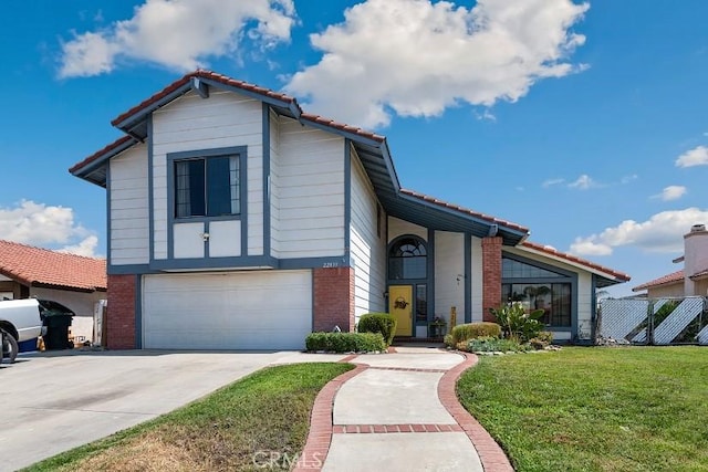 view of front of property with a garage and a front yard