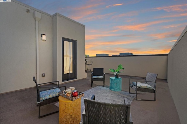 view of patio terrace at dusk