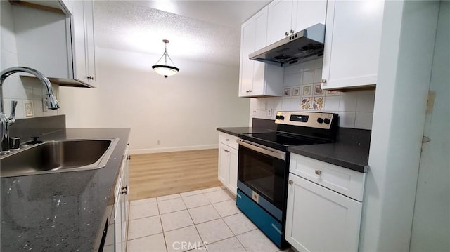 kitchen with white cabinetry, tasteful backsplash, electric range, and sink