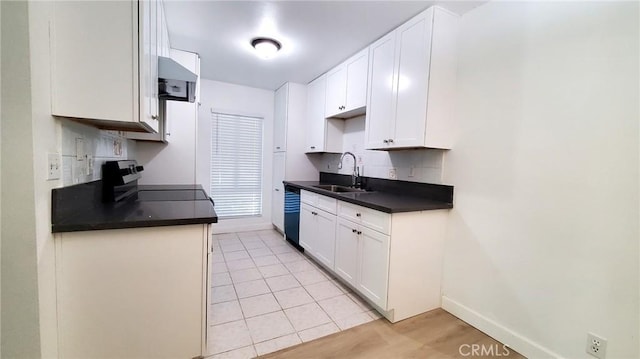 kitchen with stove, white cabinets, sink, light tile patterned floors, and black dishwasher