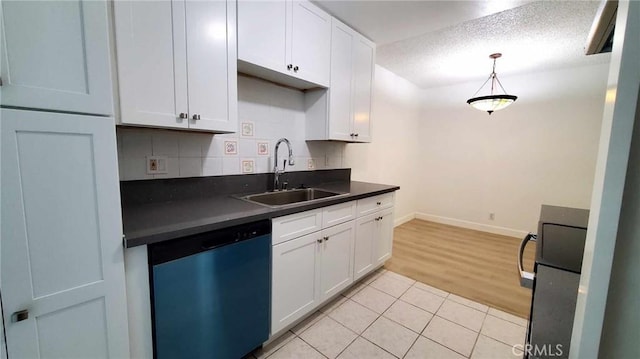 kitchen with white cabinetry, dishwasher, sink, light hardwood / wood-style flooring, and decorative backsplash