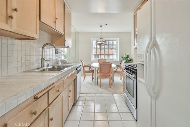 kitchen featuring appliances with stainless steel finishes, light colored carpet, sink, light brown cabinets, and tile countertops