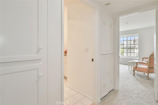 hallway with light carpet