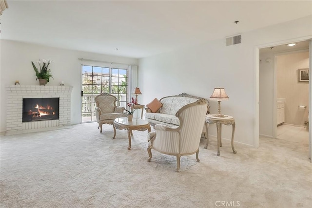 carpeted living room with a fireplace