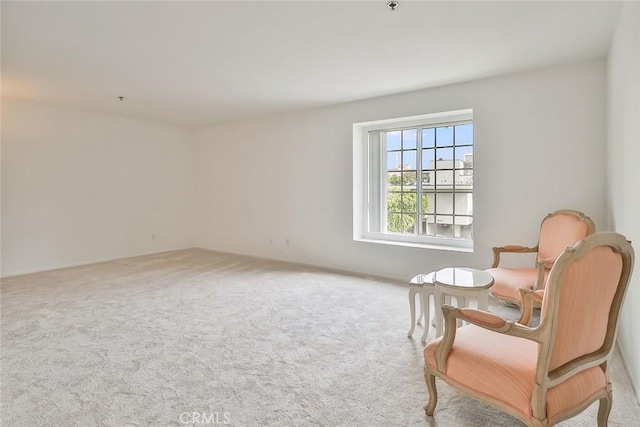 sitting room with light colored carpet