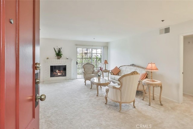 living room with a fireplace and light carpet