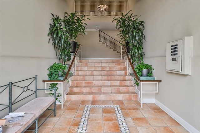 stairway featuring tile patterned flooring