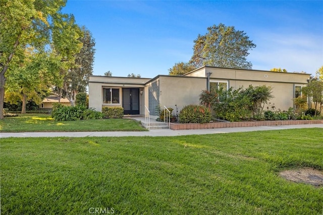 view of front of property with a front lawn