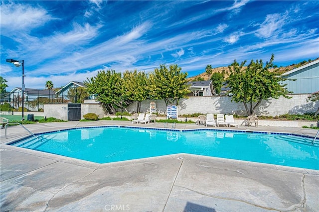 view of swimming pool featuring a patio area