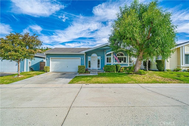 single story home featuring concrete driveway, a front yard, and an attached garage