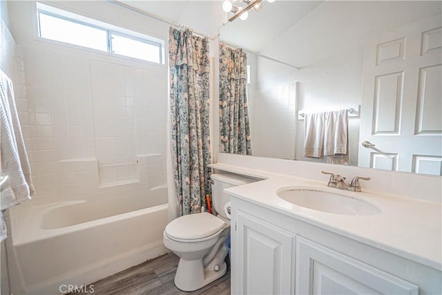 full bathroom featuring toilet, shower / bath combo, wood finished floors, and vanity
