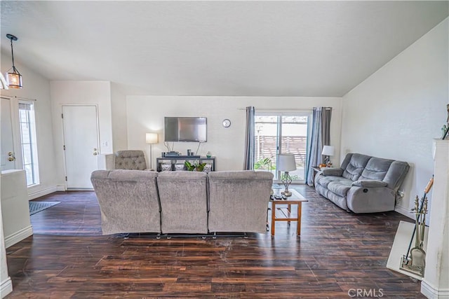 living room with dark wood-type flooring and vaulted ceiling