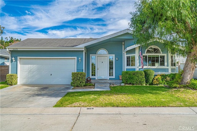 ranch-style house featuring a front lawn and a garage