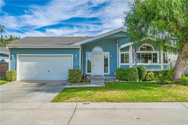single story home with a front lawn, concrete driveway, and an attached garage