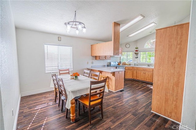 dining space featuring dark wood-style flooring, baseboards, a notable chandelier, a textured ceiling, and lofted ceiling