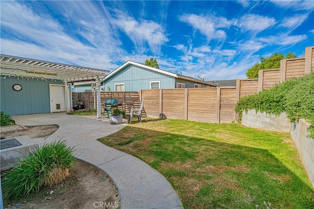 view of yard with a pergola and a patio area