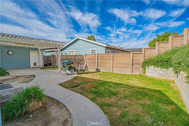 view of yard with a fenced backyard, a pergola, and a patio area