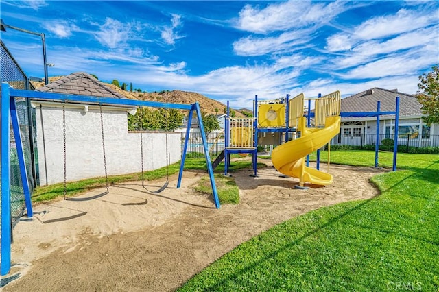 view of jungle gym with a lawn