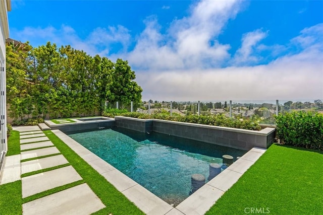 view of swimming pool featuring an in ground hot tub and a yard