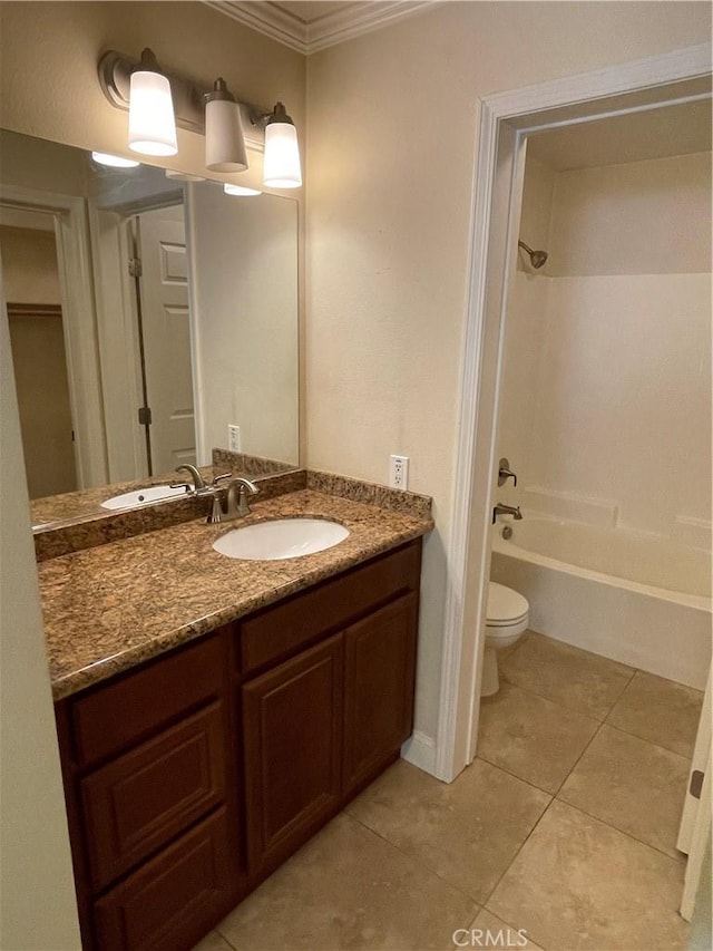 full bathroom featuring toilet, bathtub / shower combination, tile patterned flooring, ornamental molding, and vanity