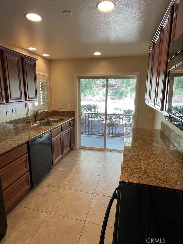 kitchen with sink, light tile patterned flooring, dishwasher, and stone counters