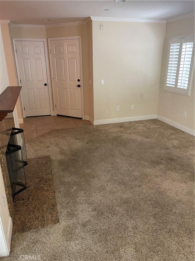 unfurnished living room with light colored carpet and crown molding