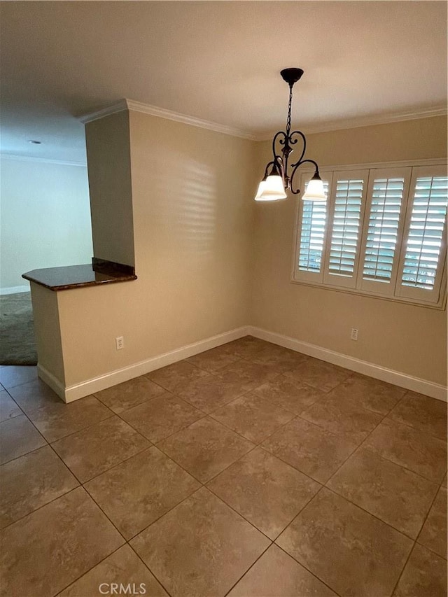 tiled empty room featuring a notable chandelier and crown molding