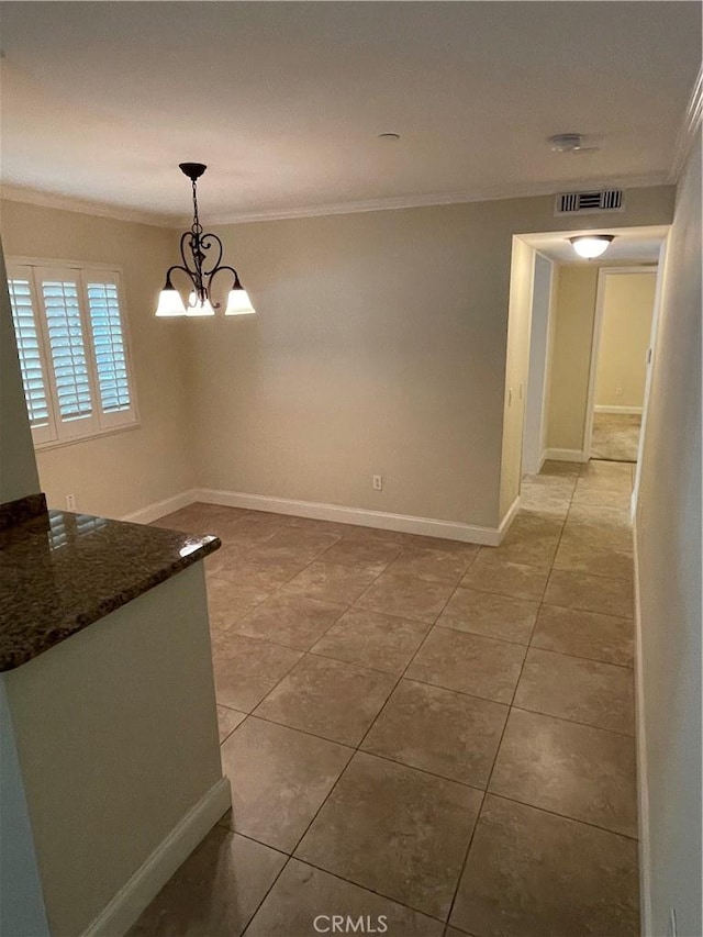 unfurnished dining area with a notable chandelier, light tile patterned floors, and crown molding