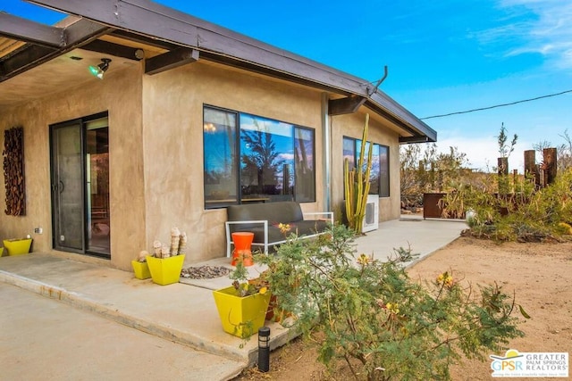 back of house featuring a patio area