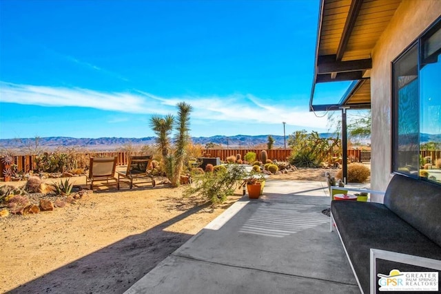 exterior space featuring a patio area and a mountain view