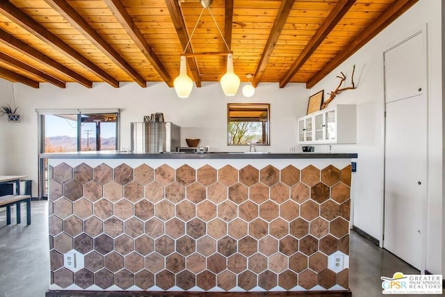 kitchen featuring a wealth of natural light, pendant lighting, beam ceiling, and wood ceiling