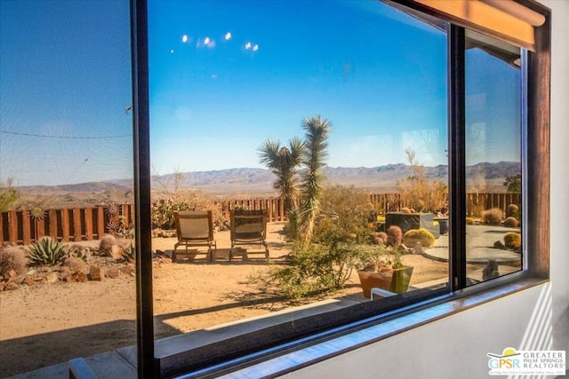 interior space featuring a wealth of natural light and a mountain view