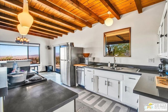 kitchen with pendant lighting, appliances with stainless steel finishes, wood ceiling, white cabinetry, and beam ceiling