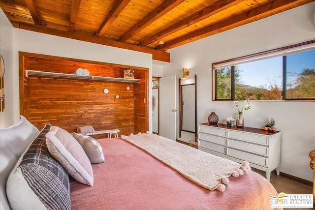 bedroom with wood ceiling and beam ceiling