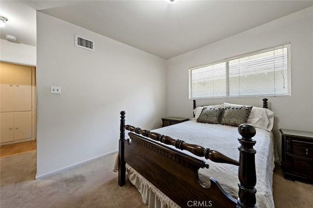 bedroom with light carpet