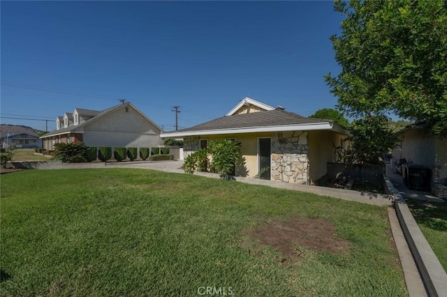 exterior space with a lawn